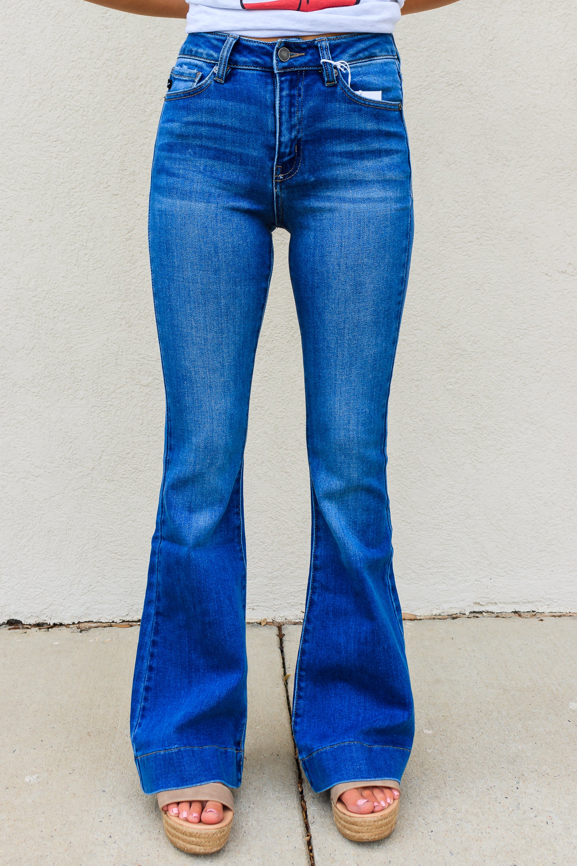 KanCan: High Rise Flare Jeans with Wide Hem - Mid Wash